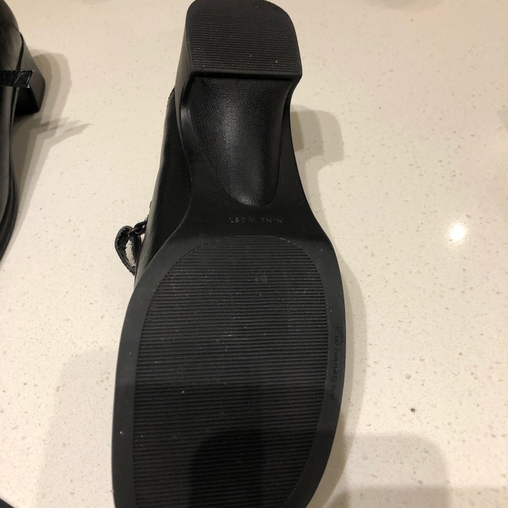 Black Nine West square toe Mary Jane shoes.